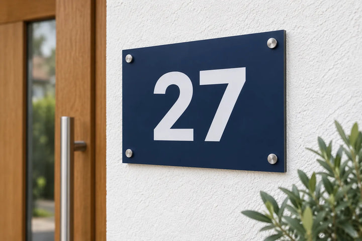 Navy aluminium house number sign 27 next to a front door